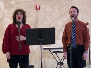 Brad Fritz and Sarah Dowling singing